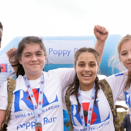 Group of friends with their Poppy Run medals