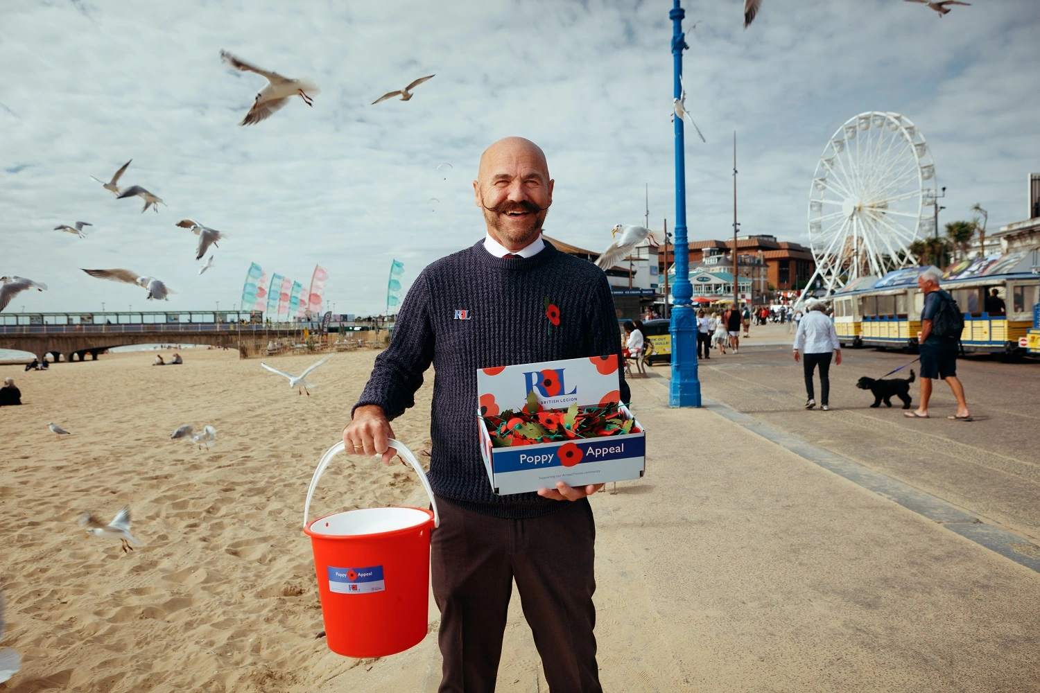 Dave Kelsey holding Poppy Appeal collection bucket