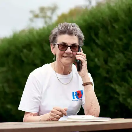 Lady on phone wearing RBL top Lady on phone wearing RBL top