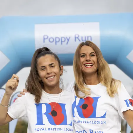 Two ladies posing at the Poppy Run start line
