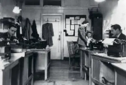 Black and white photography of news room at BBC house