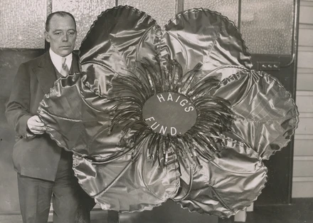 Bill Williams Factory Foreman with the largest poppy ever made Bill Williams Factory Foreman with the largest poppy ever made