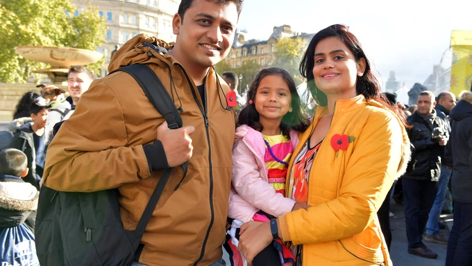 A family wearing poppies