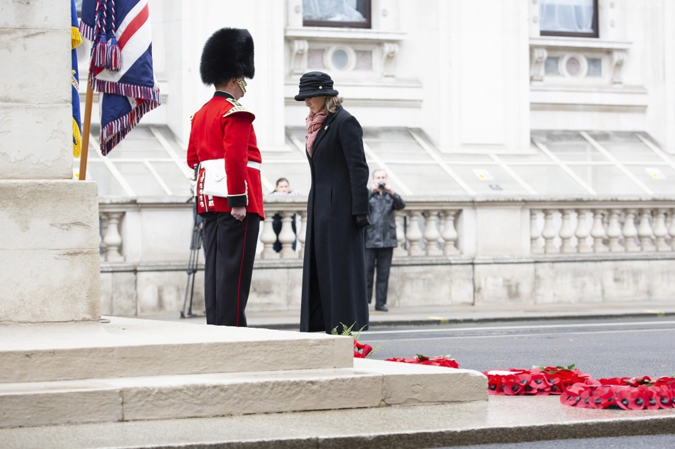 A military widow laying a wreath