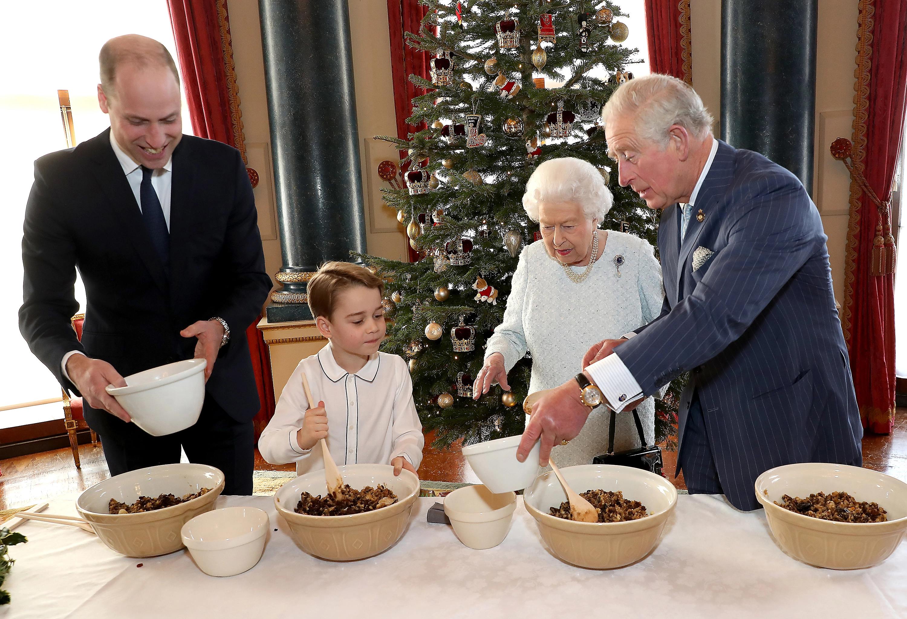 Four generations of the Royal Family bake puddings for Christmas