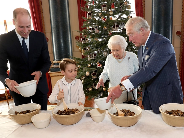 The photos were taken last week in the palace's Music Room Four generations of the Royal Family bake puddings for Christmas