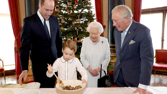 Prince William, Prince George, Her Majesty The Queen and Prince Charles bake puddings