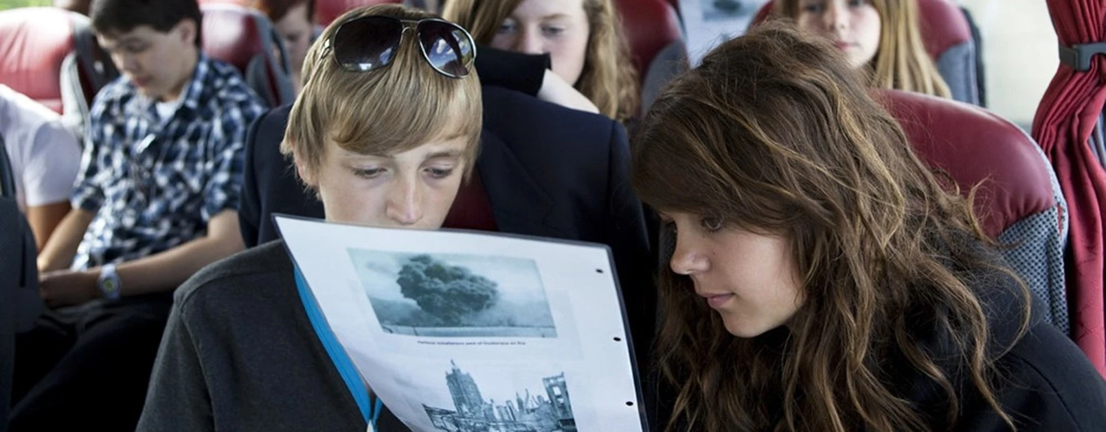 Young people on a bus for a Remembrance Travel school trip.