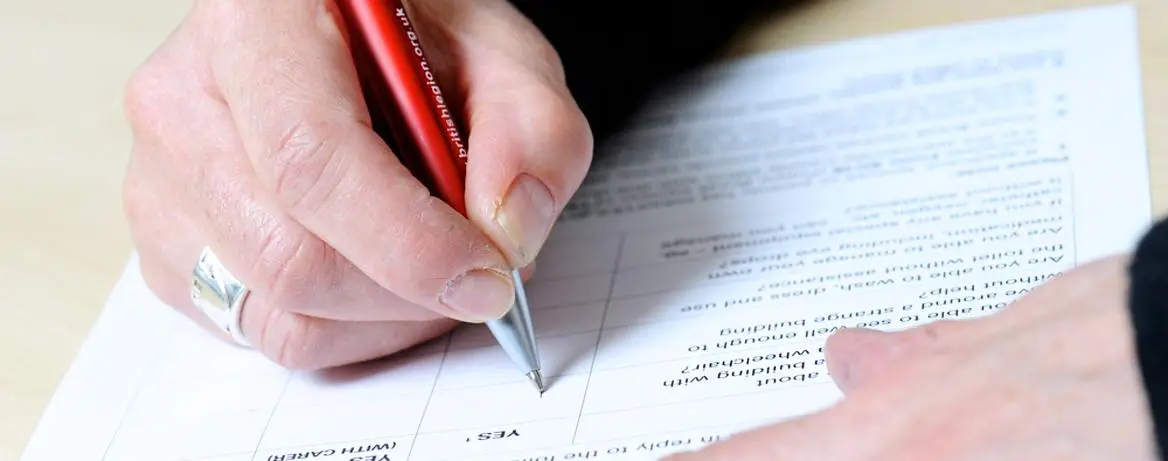 A person filling in a consultation form