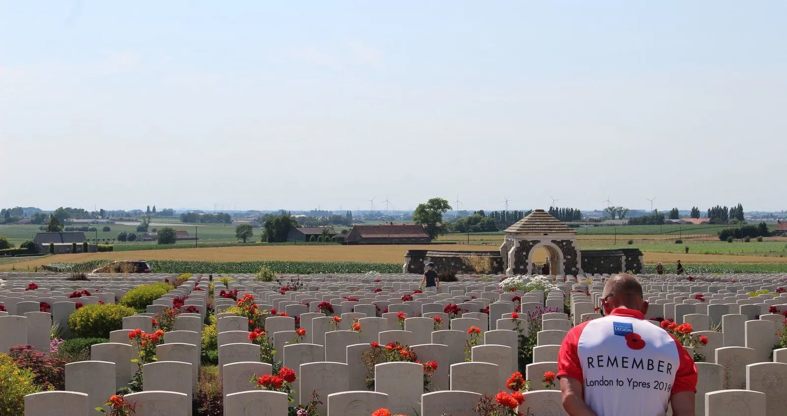 Cyclist from Pedal to Ypres ride at a graveyard in Ypres