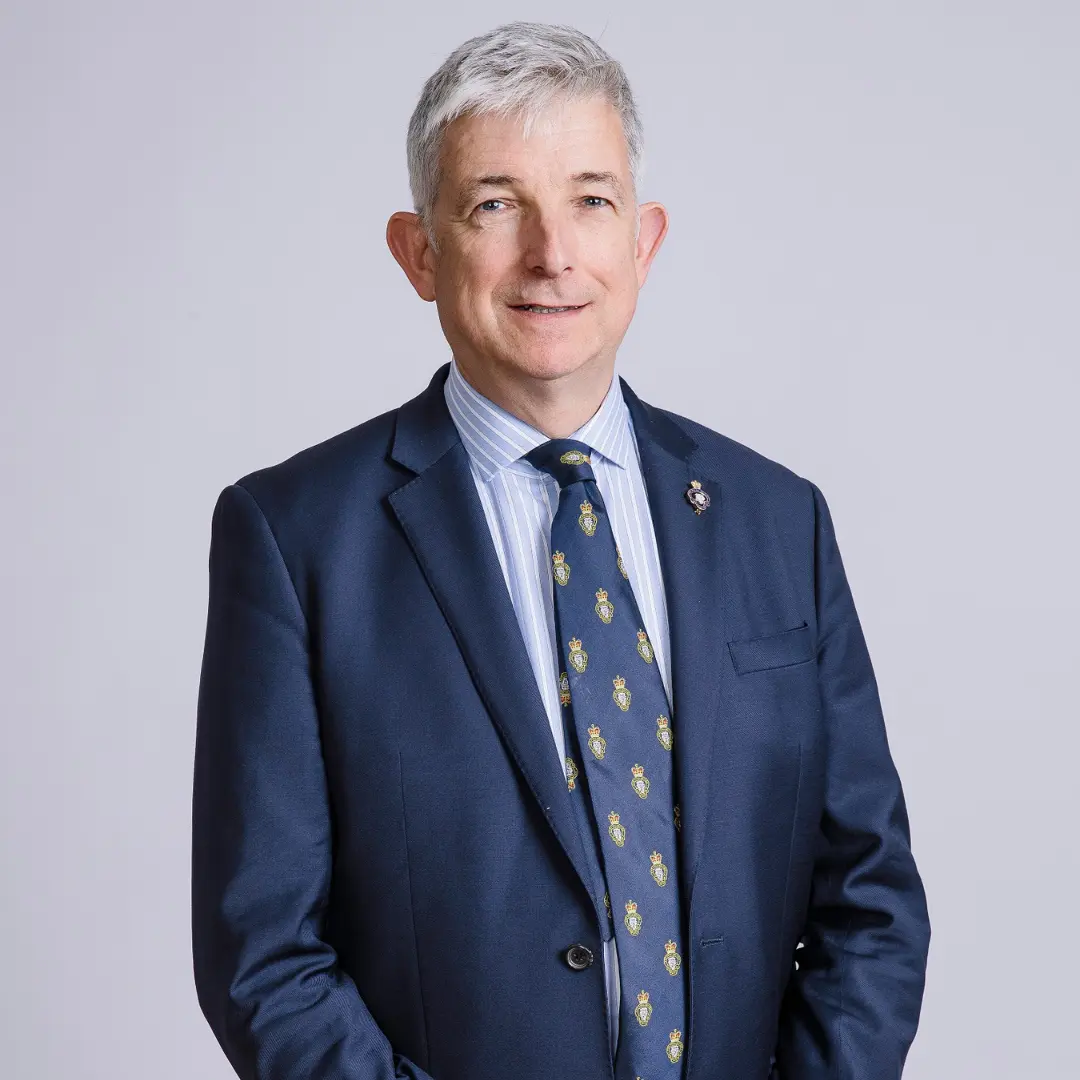 Sir Clive Johnstone pictured in bluye suit and RBL members tie