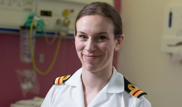 Royal Navy Surgeon Lieutenant Katie Newlands at work in a hospital room 
