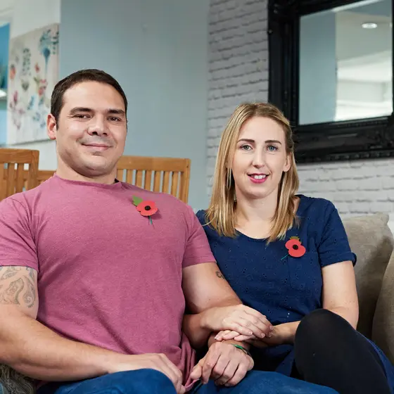 Finacial_and_employment_Support_hero A couple who have received support from the Royal British Legion sitting on a sofa