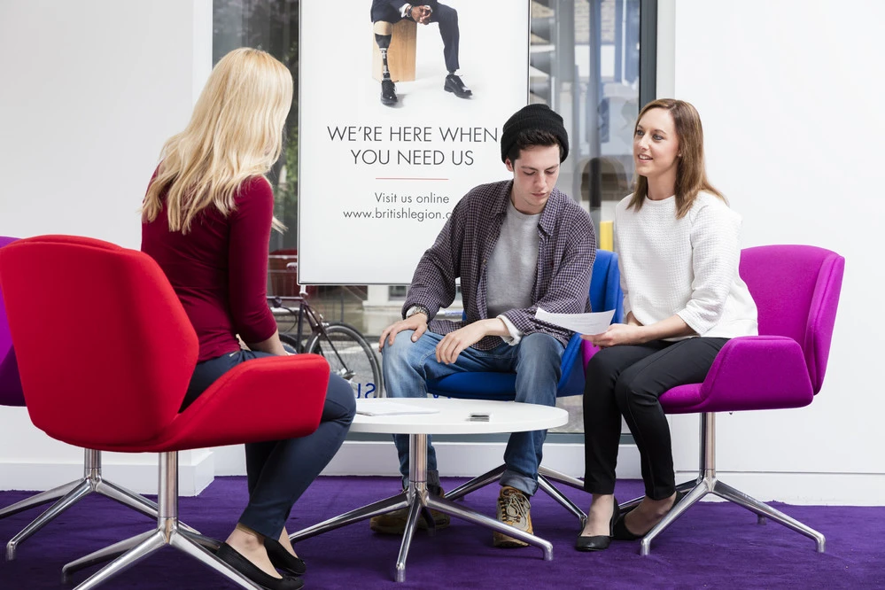 Two people visiting a Royal British Legion pop in Centre