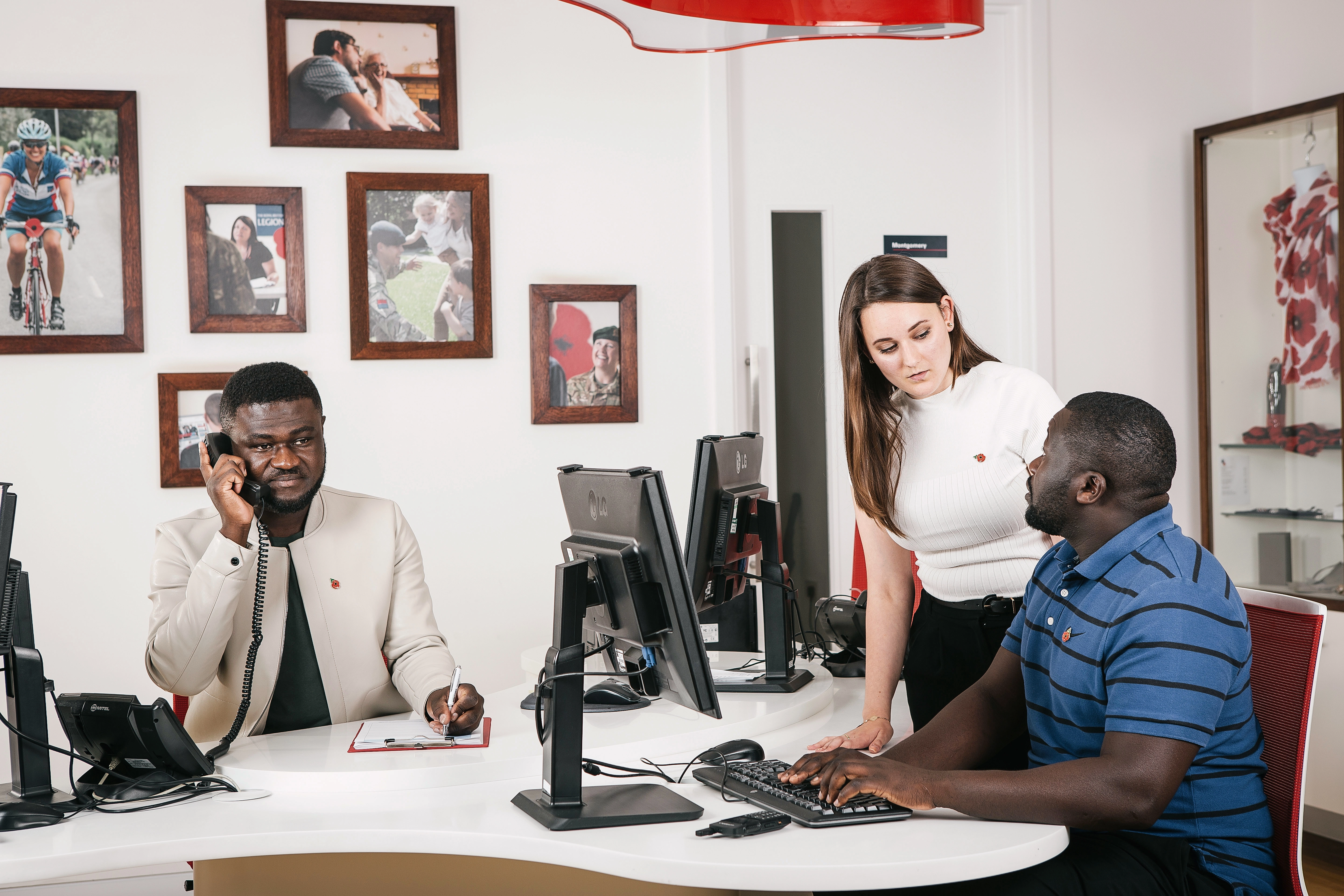 Three people working in a office 