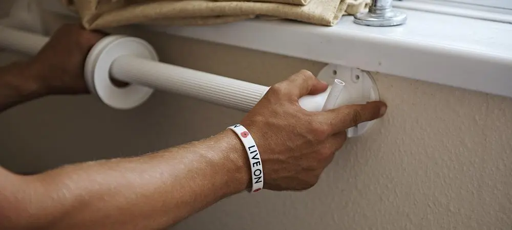 Someone fitting a handrail