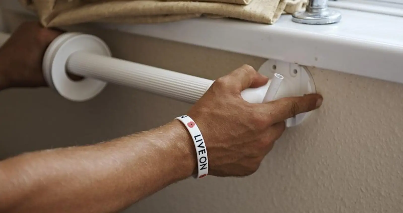 finance_household_adaptions_hero Someone fitting a handrail