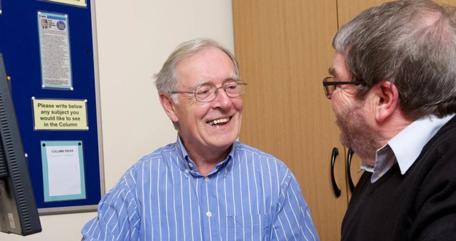 help_with_disability_hero Two men having a meeting