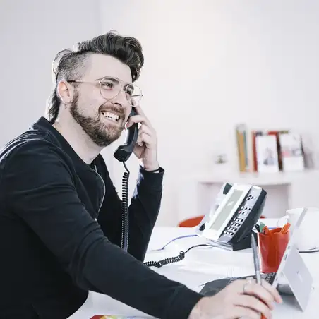 Man on telephone at desk