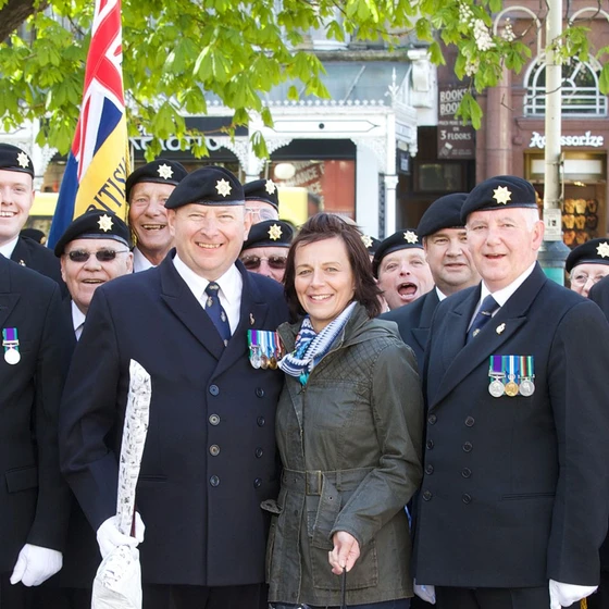 Members of local branch pose wearing medals