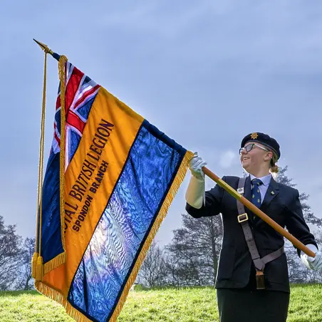 Youth member Maddie Hempell holding her branch Standard Youth member Maddie Hempell holding her branch Standard