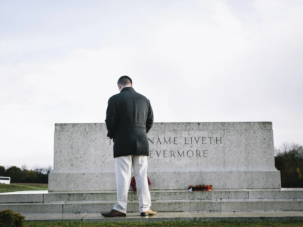 Veteran Liam Young bows his head before a memorial on a trip to the battlefields of the First World War