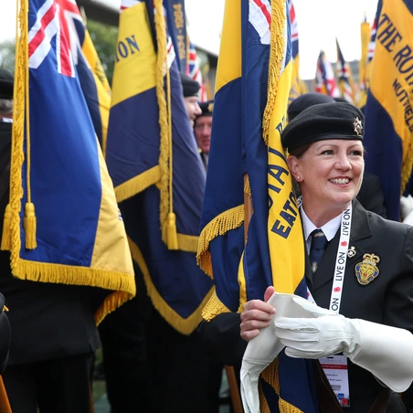Legion branch Standard Bearer preparing for parade A Royal British Legion branch Standard Bearer preparing for a parade