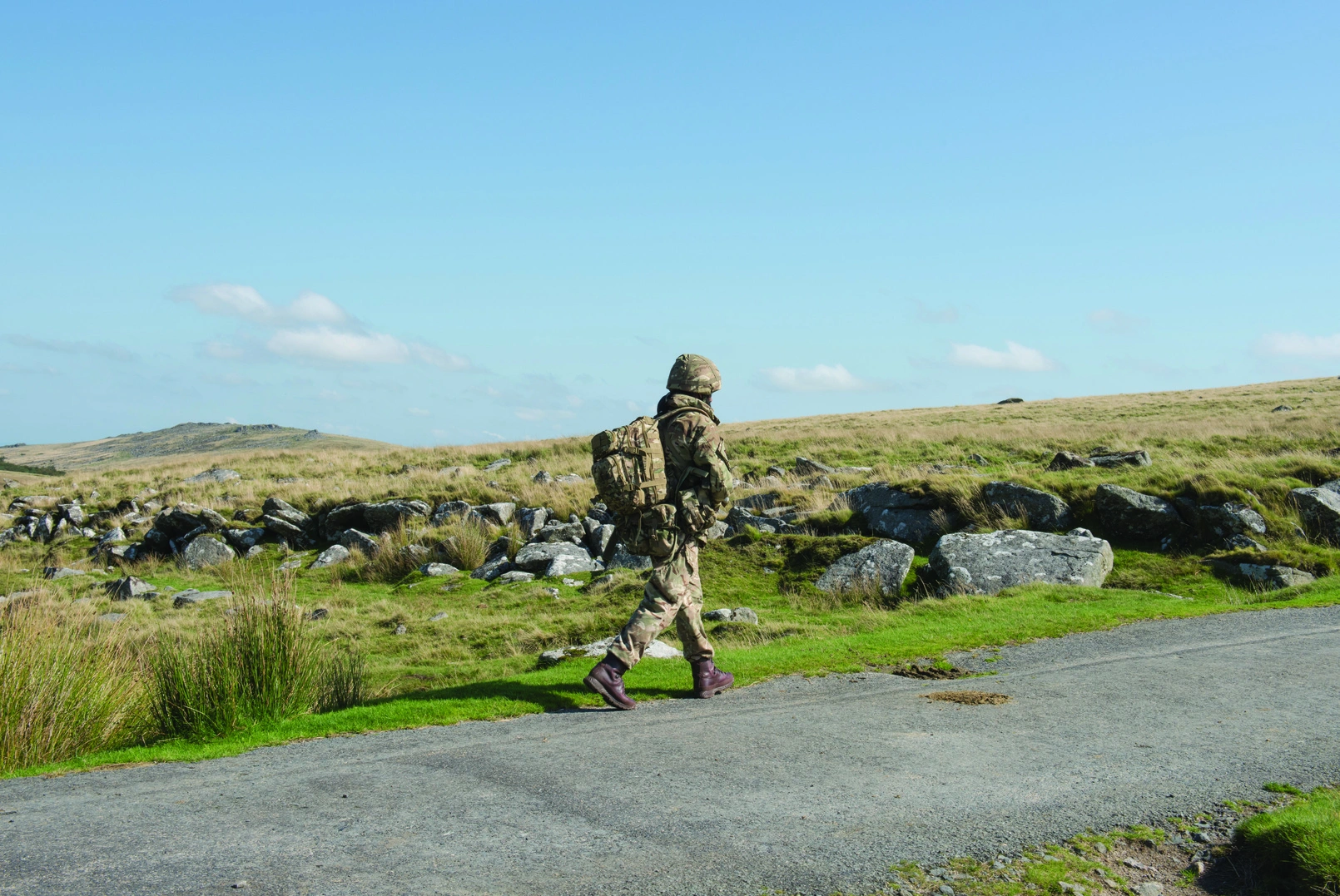 Soldier walking along roadside
