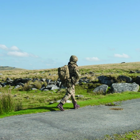Soldier walking along roadside