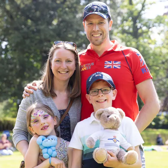 Invictus Games participant at friends and family day, accompanied by his wife and two children