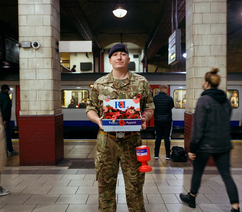 Ashley Martin collecting on the London Underground