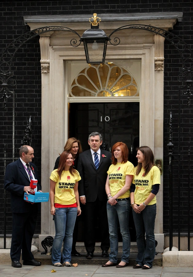 Gordon Brown with Poppy Appeal volunteers outside 10 Downing Street in 2009