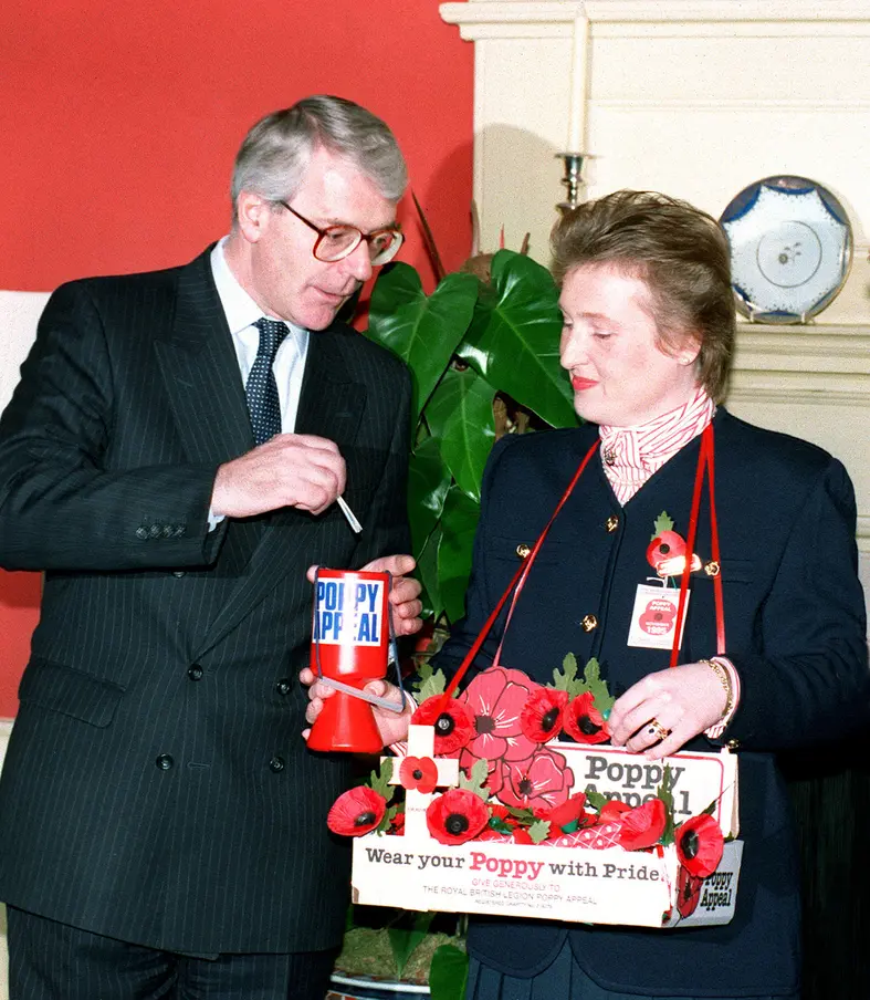 John Major donating to Poppy Appeal in 1995