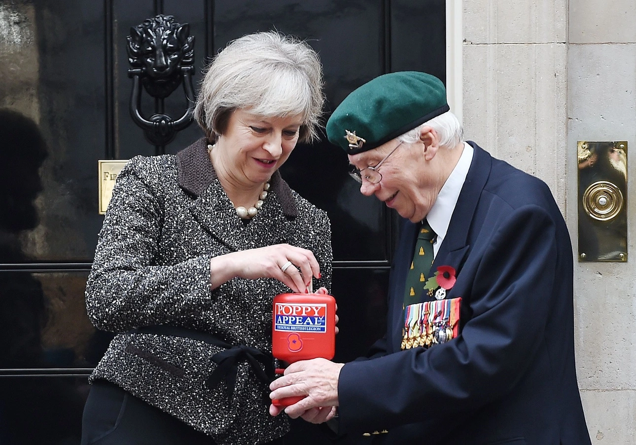 Theresa May meeting a veteran outside Downing Street