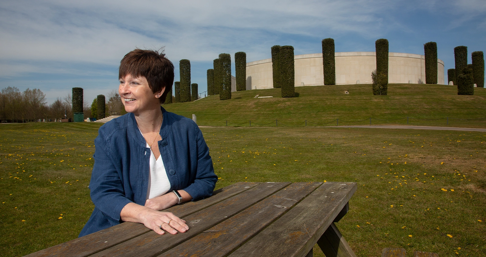 Woman sitting outside on bench