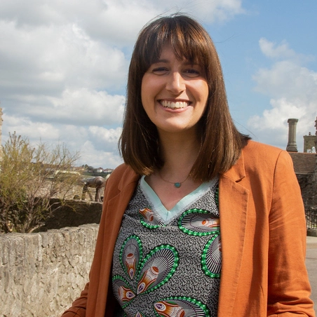 Holly Goodberry Woman standing next to castle