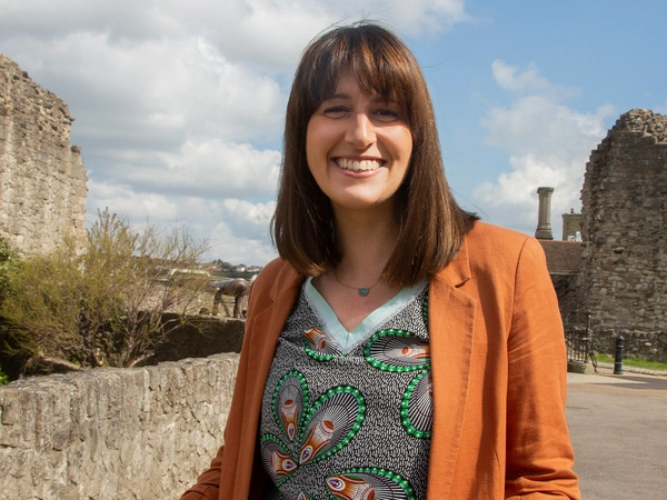 Holly Goodberry Woman standing next to castle
