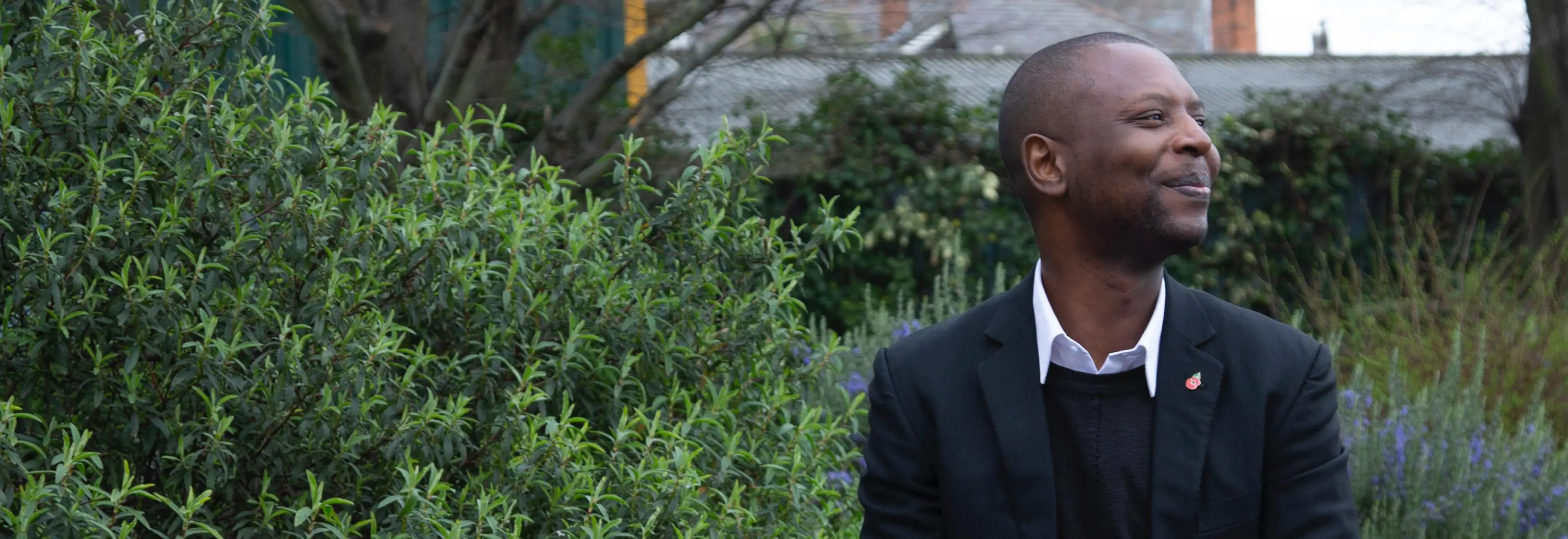 Man on bench smiling