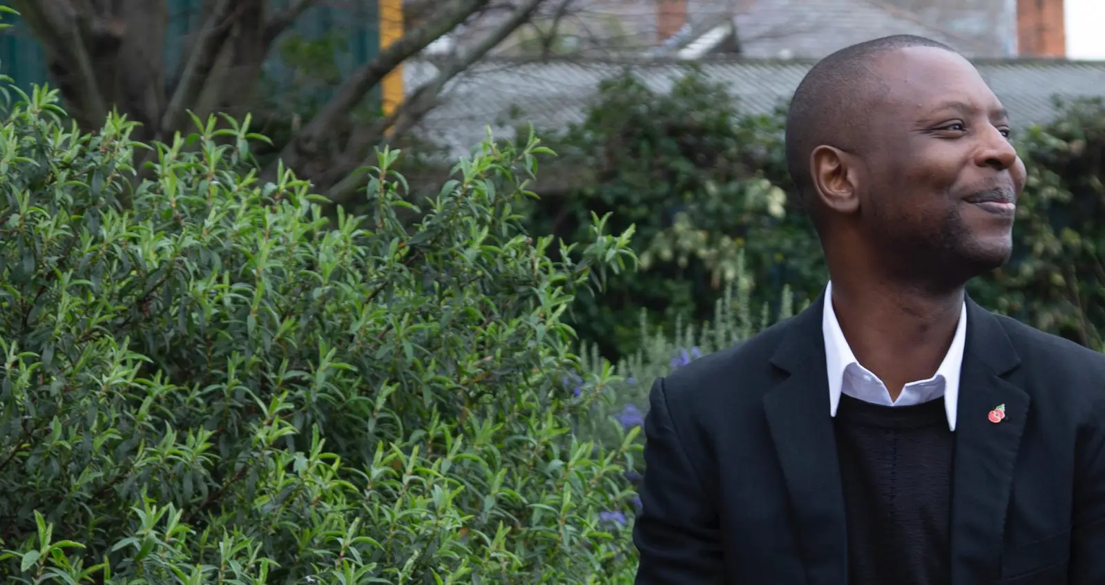 Employee Story_Henry hero Man on bench smiling