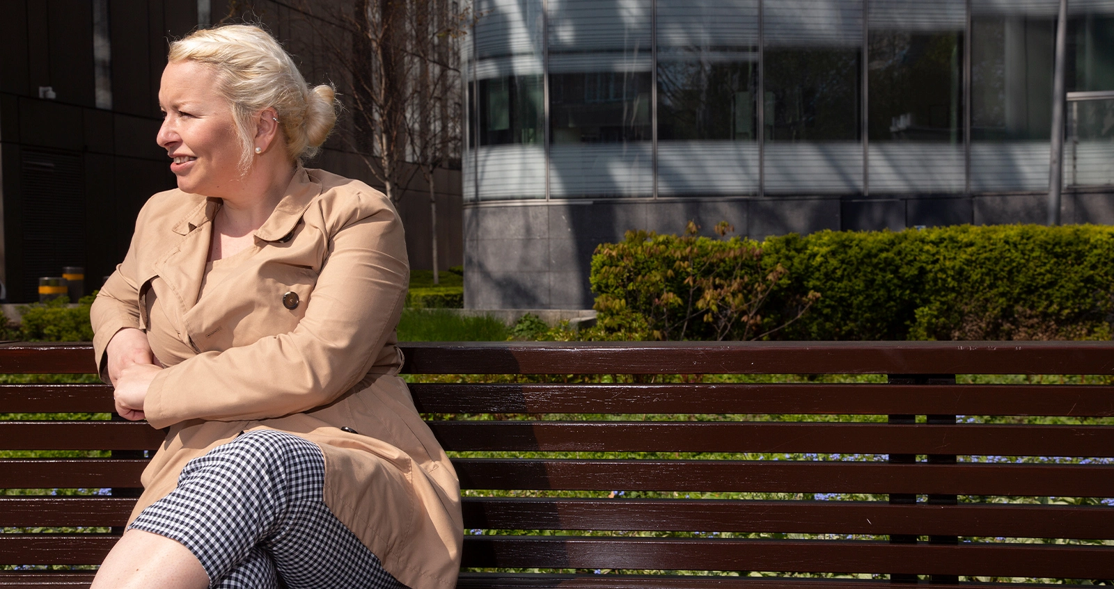 Woman sitting on bench outside