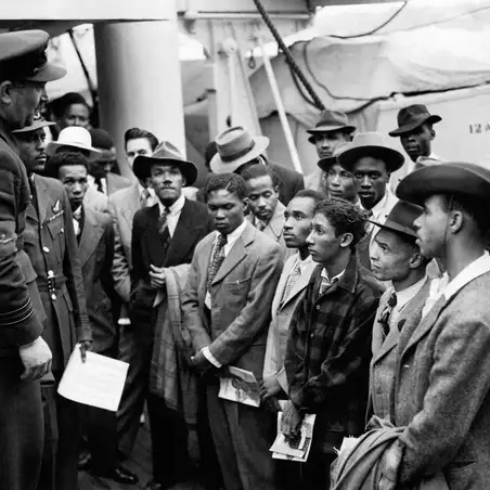 50522 Windrush RAF officials welcome settlers - Windrush 75