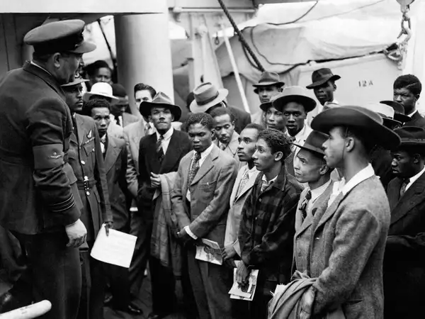 50522 Windrush RAF officials welcome settlers - Windrush 75