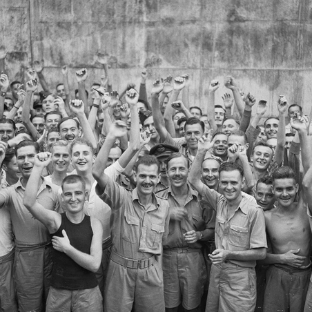Allied prisoners of war celebrating their liberation from Changi Jail, Singapore © IWM (CF 712)