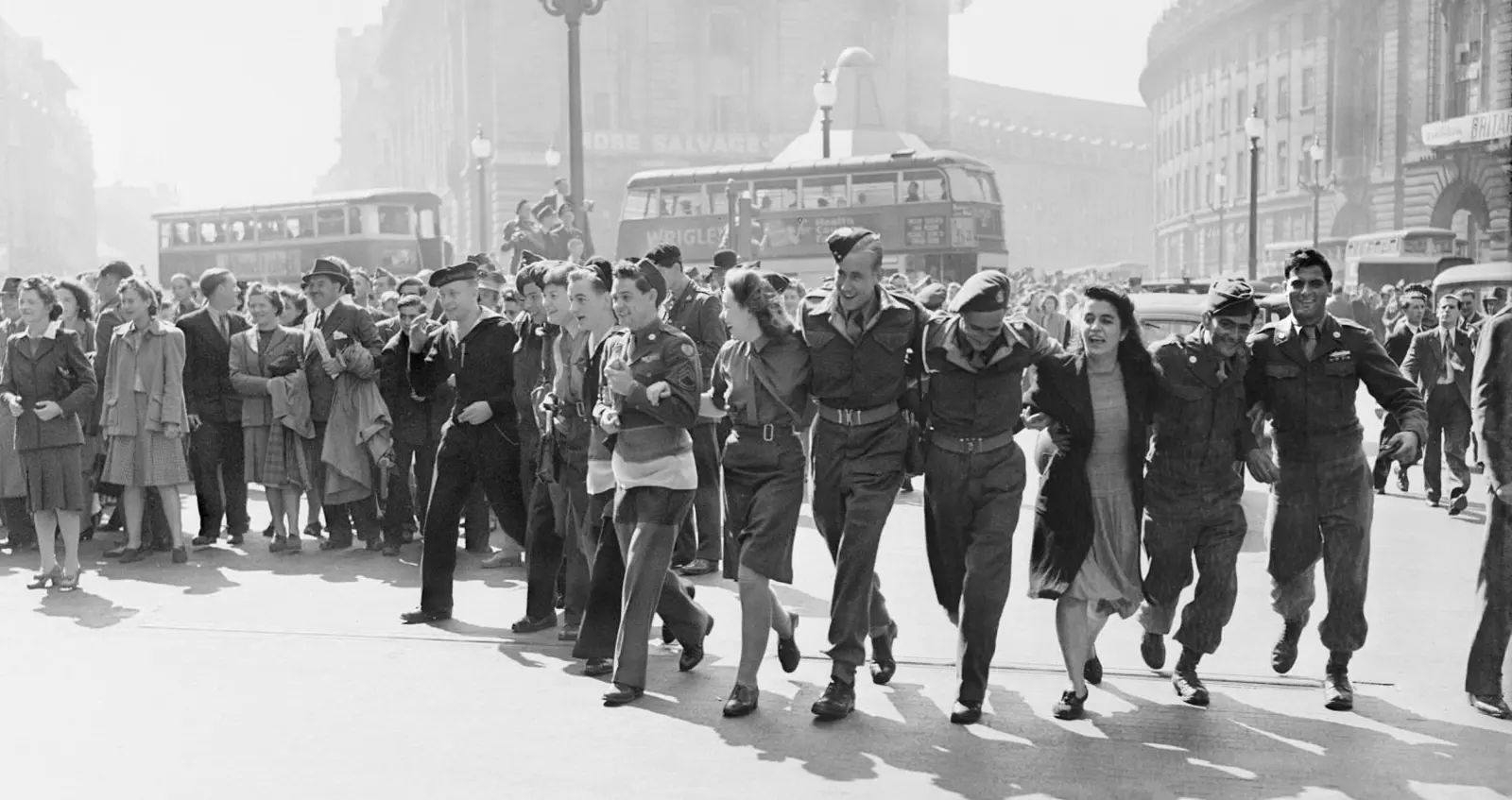 Civilians and service personnel in London celebrate the news of Allied Victory over Japan in August 1945