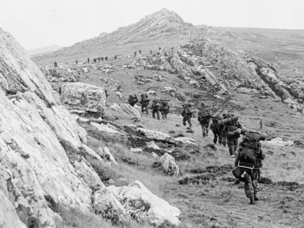 42 Commando, Royal Marines, moves off Mount Harriet during the mountain battles