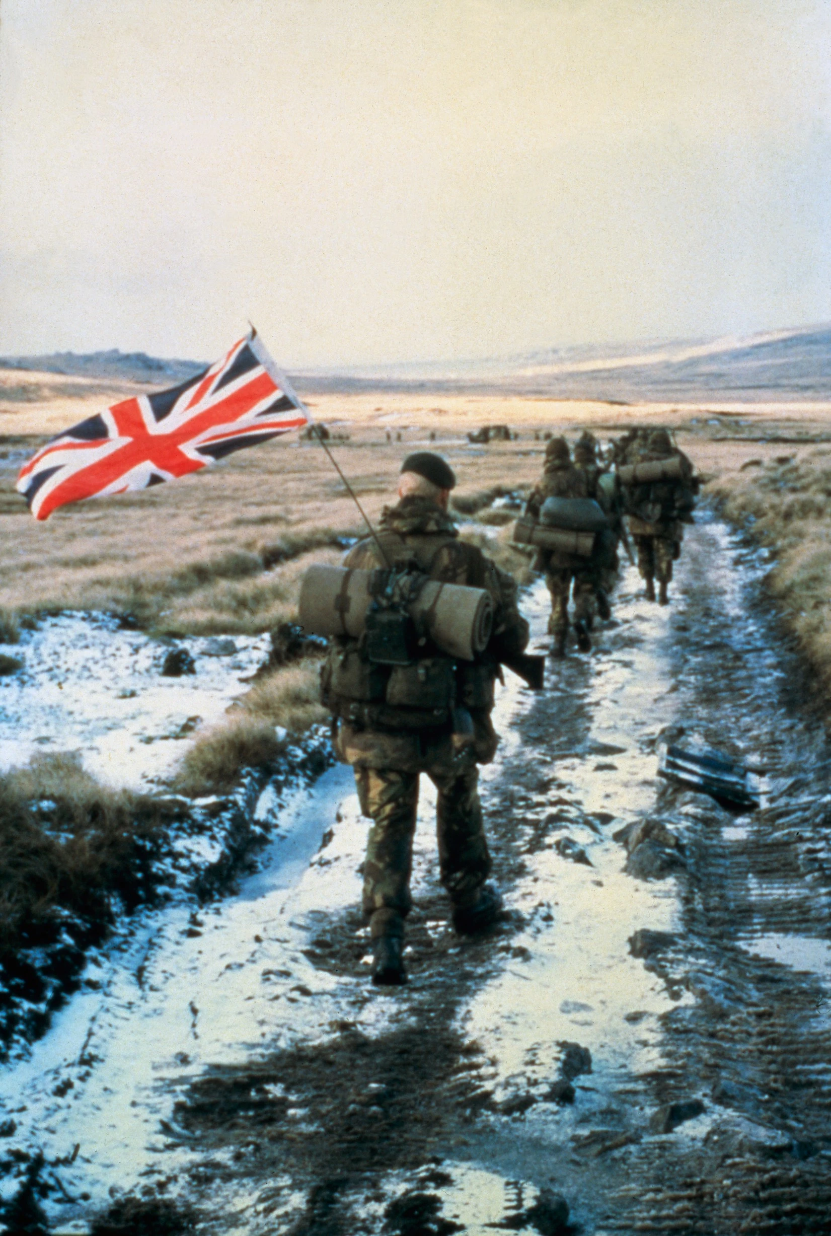 Serving personnel with Union Jack flag in backpack