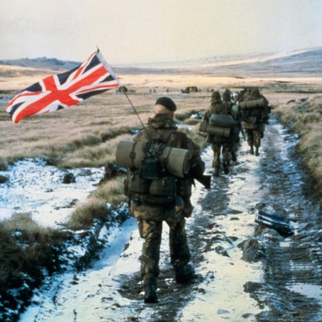 Serving personnel with Union Jack flag in backpack