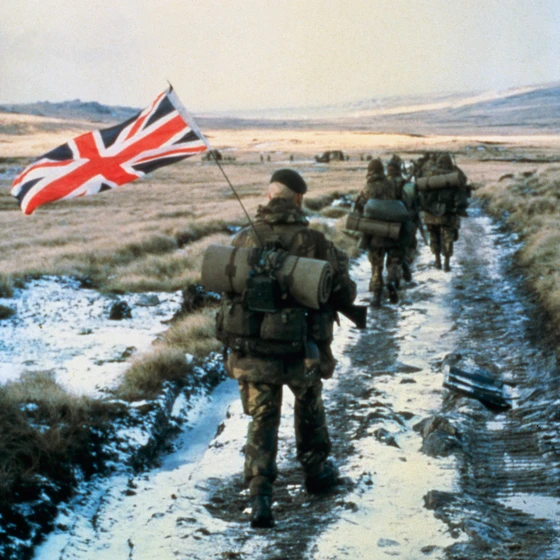 Serving personnel with Union Jack flag in backpack