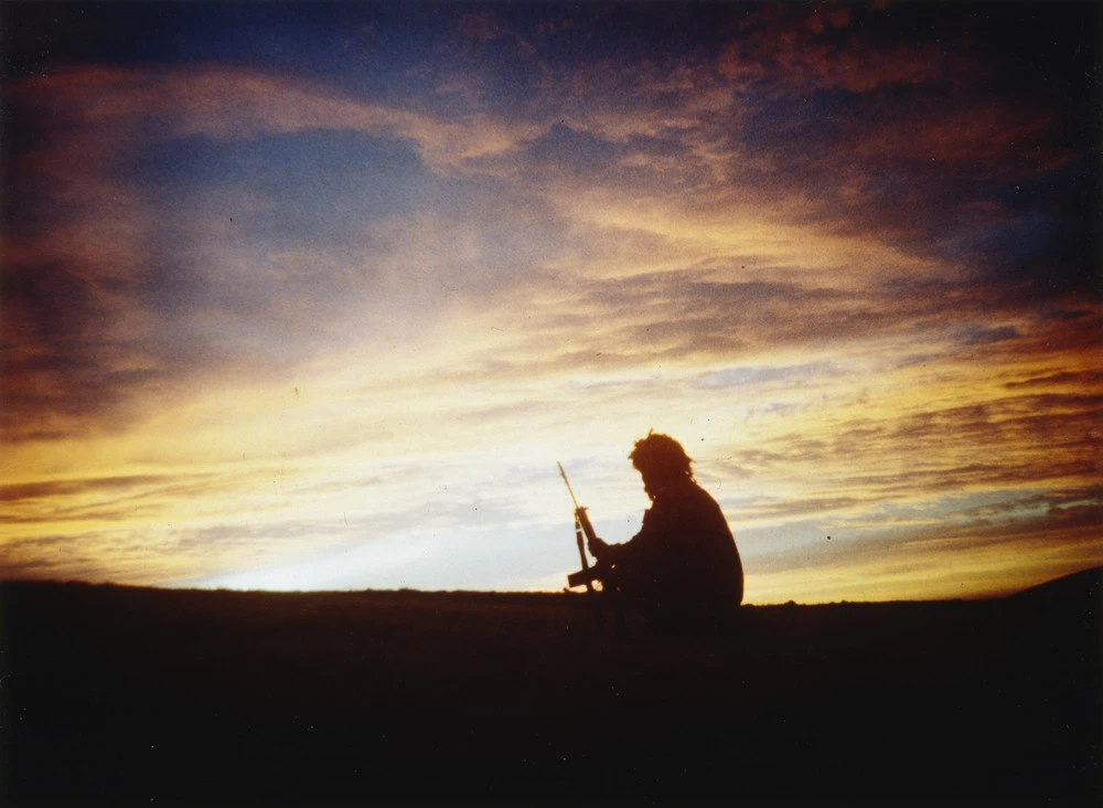 A soldier of 3 Battalion, Parachute Regiment silhouetted against the sunset