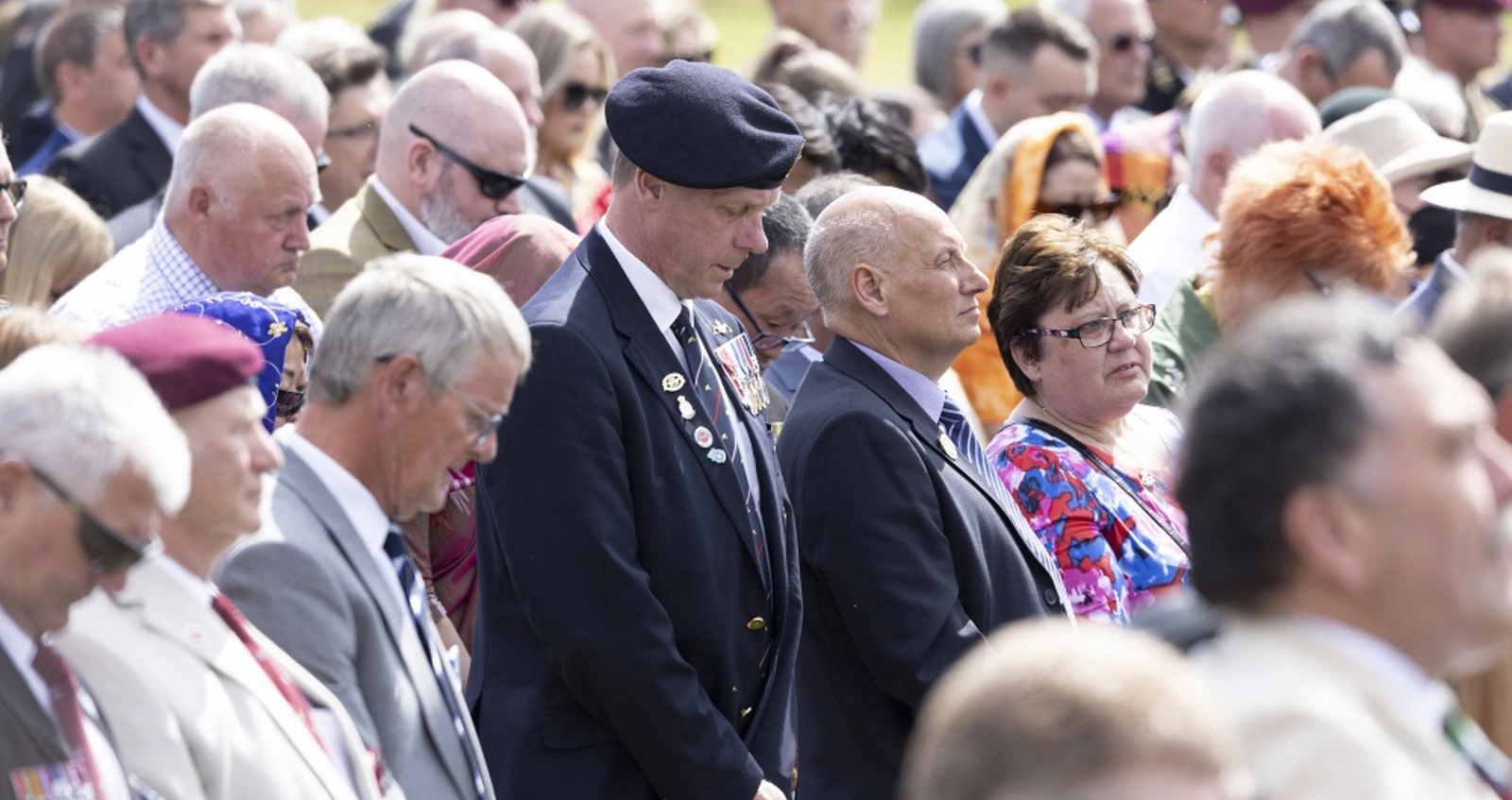 Attendees bowing their heads during the two-minute silence for the 40th anniversary of the Falklands War